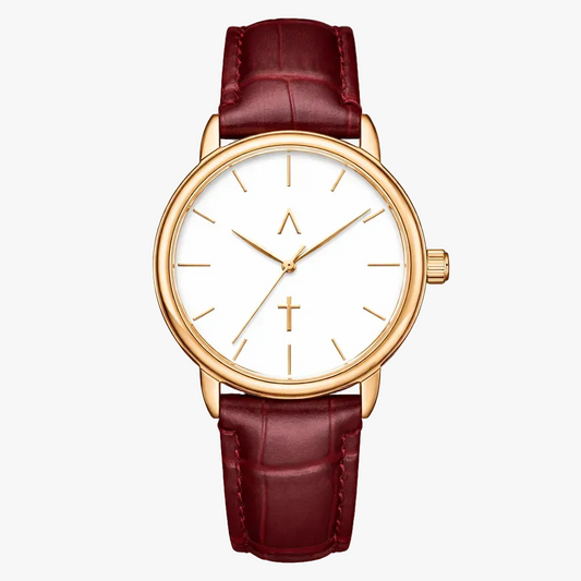 Wristwatch with gold case and red leather strap on a white background